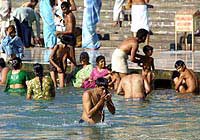 Bathing in the Ganges at Haridwar. I hope he's not drinking that!
